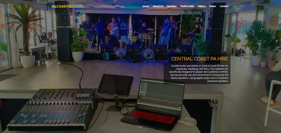 Coastal Audio website home page: a band on stage behind a digital mixing desk, with the heading "Central Coast PA hire"