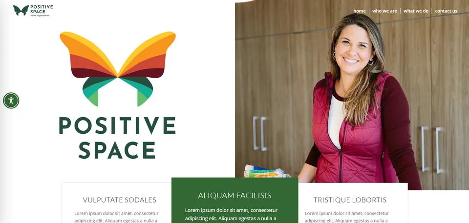Positive Space website: a large orange and green butterfly logo beside a photo of a smiling woman, with three service tiles below