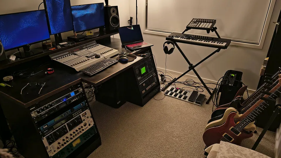The Studio Projects studio: monitors, a mixing control surface, outboard rack gear, keyboards and guitars